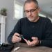 Man checking his blood sugar with a blood sugar monitor