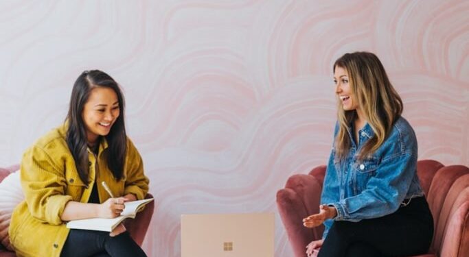 3 women sitting on chair