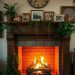 Cozy fireplace with flames, family photos on the mantel, and plants around it.