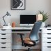 A modern home office featuring a sleek desk, ergonomic chair, and stylish decor.