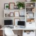 A compact home office with two monitors, a stylish chair, and organized shelves.