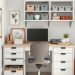 A well-organized home office with a desk, storage drawers, and shelves displaying baskets and decorative items.