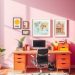 A bright home office with a pink wall, orange desk, and colorful decorations.