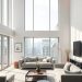 A contemporary minimalist living room with large windows, gray sofas, and a simple coffee table.