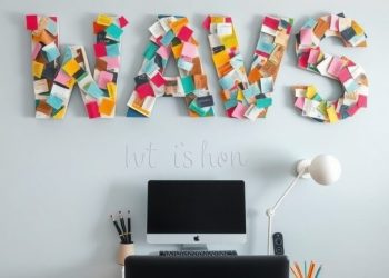 Colorful DIY wall art spelling 'WAVS' made from fabric swatches, displayed above a desk with a computer.