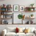 Cozy living room with floating shelves displaying books and plants