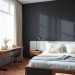 A minimalist bedroom featuring a bed with built-in storage, a wooden desk, and a cozy chair, accented by a dark wall and natural light.