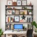 A home office with metal pipe shelving displaying books, plants, and decorative items.