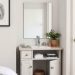 Compact vanity with sink and mirror in a small bedroom