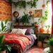 A cozy bohemian chic bedroom with plants, colorful textiles, and framed art.