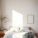 A minimalist Scandinavian bedroom featuring a wooden bed, soft bedding, and natural light.