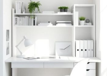 A bright and airy home office with white walls, a white desk, and green plants.
