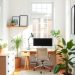 A minimalist Scandinavian home office with a desk, chair, plants, and natural light.