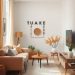 A cozy small living room featuring soft beige rugs and warm textiles, with plants and stylish furniture.